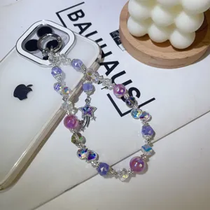 Exquisite crystal beaded phone charm with sparkling purple stones and star pendant detail.
