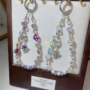 Detailed view of crystal beaded phone chain pendant featuring sparkling cut beads and cute charms.