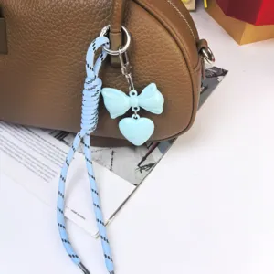 Korean style blue bow heart bag charm braided rope keychain cute purse accessory pendant.