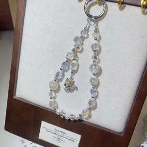Crystal beaded phone charm with dazzling rhinestones and cute pendant, short wrist strap.