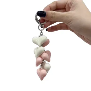 Cute resin puffy heart keychain bag charm, pink and white multi-heart metal ring pendant.