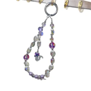 Crystal beaded phone charm with purple pearls and cute fox pendant, stylish wrist strap.