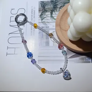 Crystal beaded phone charm with colorful square crystals and a sparkling heart pendant.