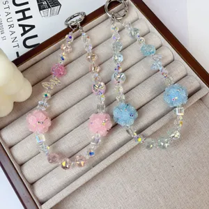 Crystal beaded phone charm and cute bag pendant with flower balls for stylish accessories.