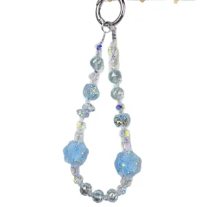 Blue crystal beaded phone charm with rose flower balls, elegant bag keychain accessory.