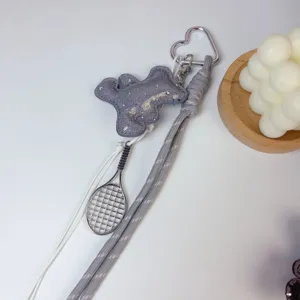 Korean style sparkling bear bag charm with tennis racket pendant and braided strap key.