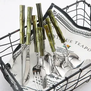 Stainless steel cutlery set with green acrylic bamboo handles, elegant steak knife fork and spoon.