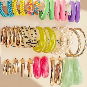 Trendy colorful resin C-hoop earrings set with pearls and metal rings for women daily wear.