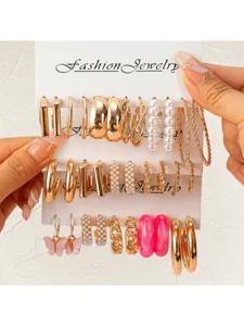 Multi-piece fashion jewelry set featuring gold hoop earrings, pearls, and pink butterfly designs.