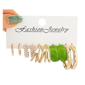 Fashion multi-style hoop earring set with pearls, resin and gold-tone metal designs.