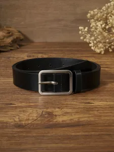 Women black leather belt with rectangular silver buckle detail shot, minimalist waist accessory