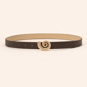 Women's detail view dark brown fashion leather belt featuring an elegant gold spiral seashell metal buckle.