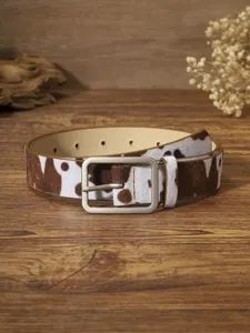 Cow print leather belt detail showcasing rectangular metal buckle and stylish design for dress.