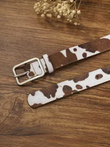 Brown and white cow print thin leather belt with silver square pin buckle close-up detail shot.