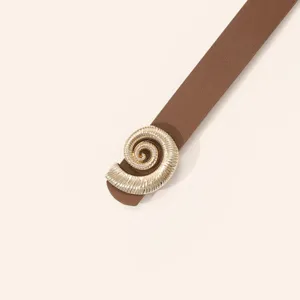 Close-up detail of the elegant brown leather belt featuring a unique gold spiral buckle design.