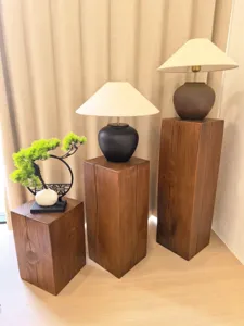 Detail view of wabi-sabi solid wood display stand pier and stool for home decor and living room.