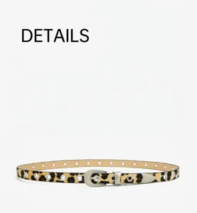 Gros plan détaillé d'une élégante ceinture fine à imprimé léopard avec œillets métalliques.