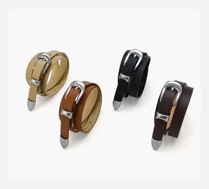 Detailed view of four stylish women's leather belts in various colors with metallic silver buckles.