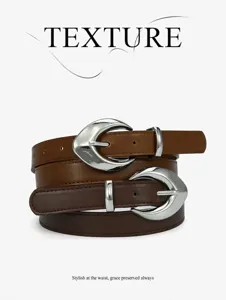 Detail view of stylish brown leather belt with unique crescent metal buckle, chic waist accessory.