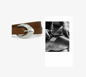 Detailed view of the women's brown leather belt featuring a unique silver crescent moon pin buckle.