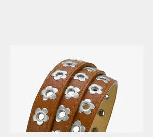 Punk style plum blossom grommet PU thin belt detail view, fashionable metal eyelet strap.