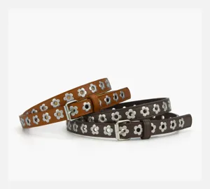 Detail shot of punk style floral eyelet PU thin belt with metal buckle, close-up design.