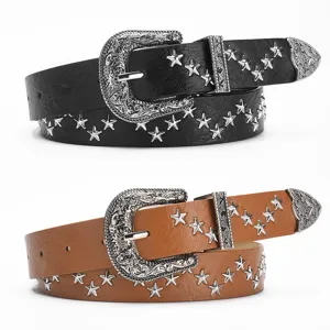 Detailed view of vintage western style leather belts with ornate buckles and star studs.