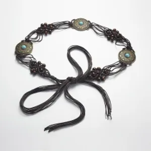 Handmade braided leather waist belt with decorative metal medallions and wooden bead accents.