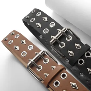 Punk style wide leather belt with double grommets and metal studs for women jeans outfit.
