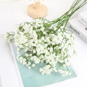 Detailed close-up shot of artificial white baby's breath flowers, ideal for home decor.