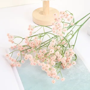 Close-up detail of artificial baby's breath flower bouquet, pink floral decor for room and party.