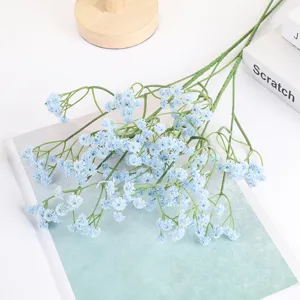 Detail shot of artificial baby's breath flowers bouquet, blue floral arrangement close-up decor.