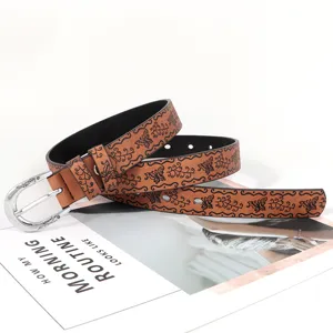 Ceinture en cuir gaufré marron pour femme avec motif papillon vintage et boucle en métal argenté.