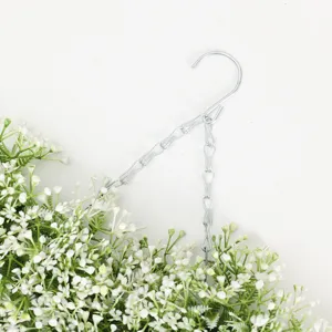 Artificial hanging flower wreath with metal chain and white blooms for home and live decor.