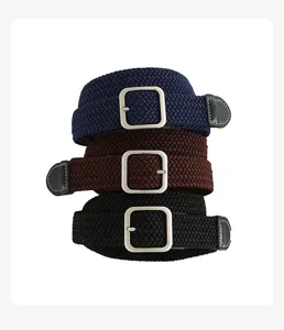 Detailed view of woven elastic belt featuring metal square buckle and leather tip design.