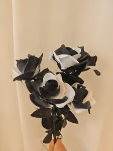Halloween artificial black and white roses bouquet for gothic home decor and photography props.