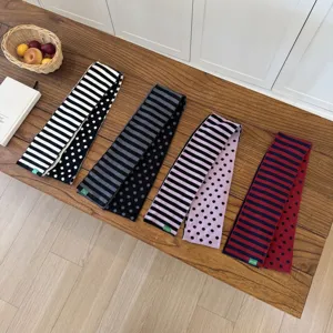 Classic knit scarf featuring dual-side striped and polka dot patterns, cozy winter wear for daily styling.