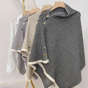 Stylish women's chevron knit cape shawl poncho with button detail for autumn winter wear.