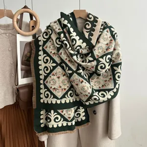 Detailed view of the winter retro ruyi pattern cashmere feel scarf with fringe trim.