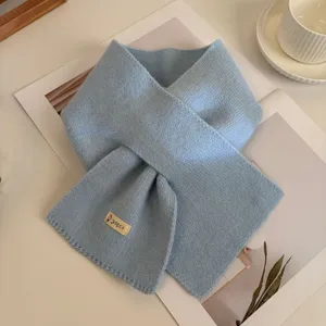 Cozy light blue knit cross scarf for women, stylish winter warm dopamine fashion neck warmer.