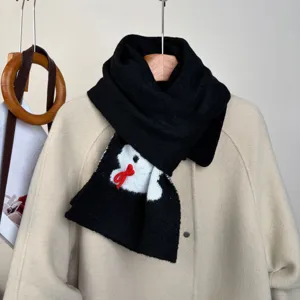 Black knitted scarf for women with cute cartoon rabbit and red bow. Soft winter warm neck.