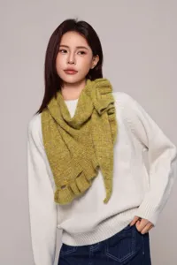 Detailed view of the stylish women ruffle knitted wool shawl, soft texture, cozy cape wear.