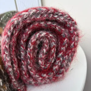 Cozy fuzzy mohair blend winter scarf featuring red and grey chic knitted detail style.