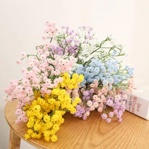 Detailed view of colorful artificial baby breath flower bouquet, perfect for home decor scene.