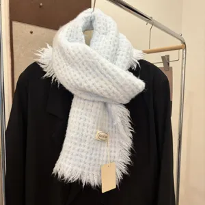 Light blue knitted fringed winter scarf, cozy warm knitted neckerchief for women.