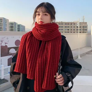 Thick knit winter scarf for women, cozy chunky red woolen scarf, warm fashion accessory.