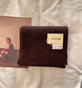 Cozy dark brown knitted winter scarf, soft fleece texture for women fashion daily wear.