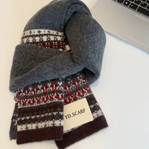 Nordic knit scarf detail shot, warm winter wool neck wrap with classic fair isle pattern.