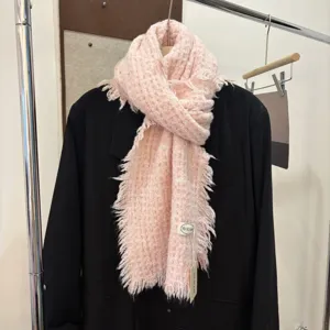 Soft pink knitted scarf with frayed edges, cozy winter warm woolen neck warmer for women.
