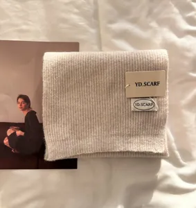 Beige ribbed knit scarf soft warm winter woolen neck wrap for women fashion cozy daily wear.
